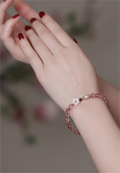 Bracelet en cristal rose doux avec fleur de cerisier