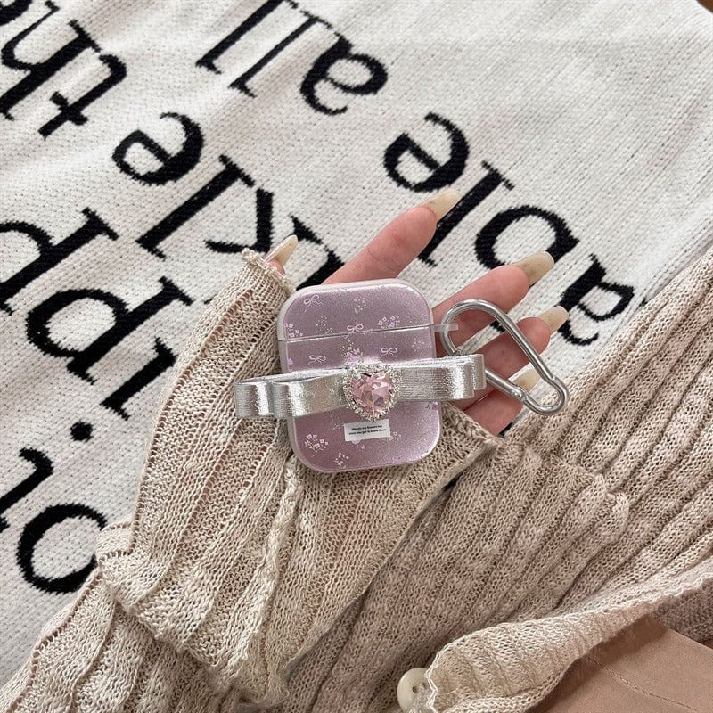 Étui AirPods avec accessoires et nœud papillon rose